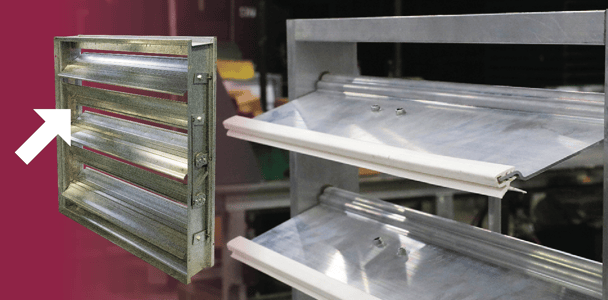 A damper with an arrow pointing to its blade seal