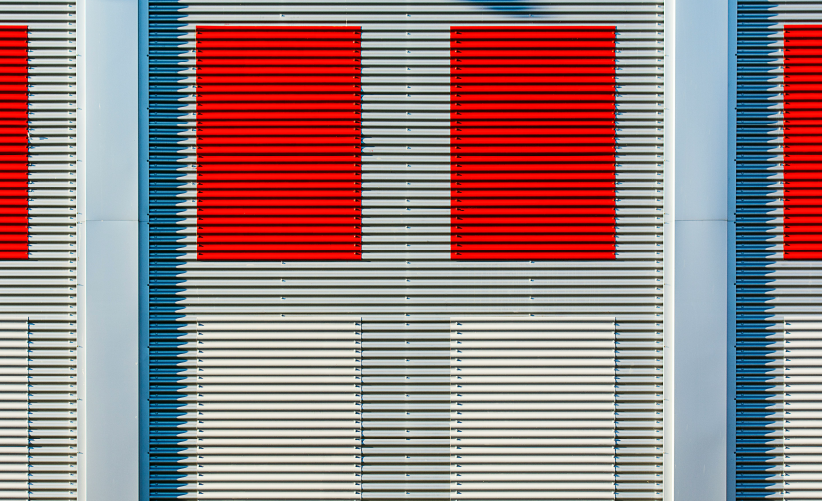 Image of a louver wall with red and white louver panels