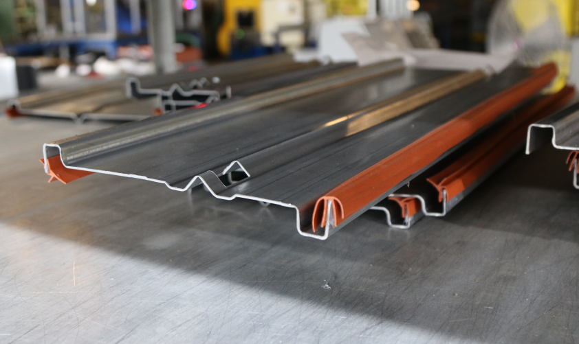 A smoke damper blade with orange blade seals