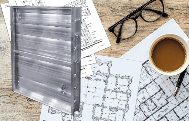 A damper beside construction plans for a building