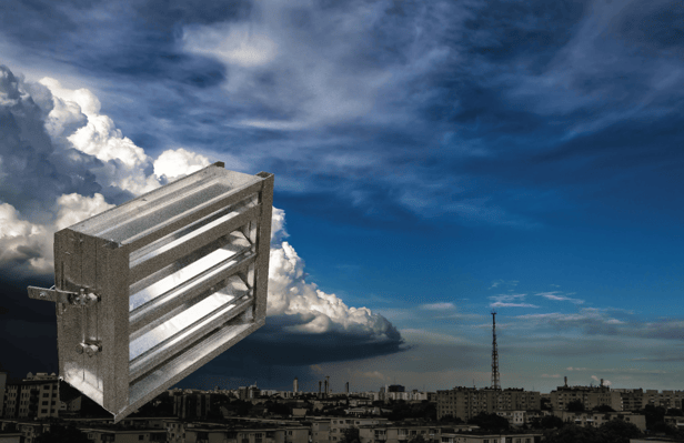 IL31A adjustable louver beside a photo of a city during a storm