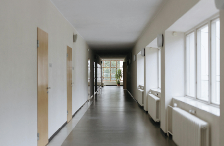 A hallway with soft lighting from a cloudy day